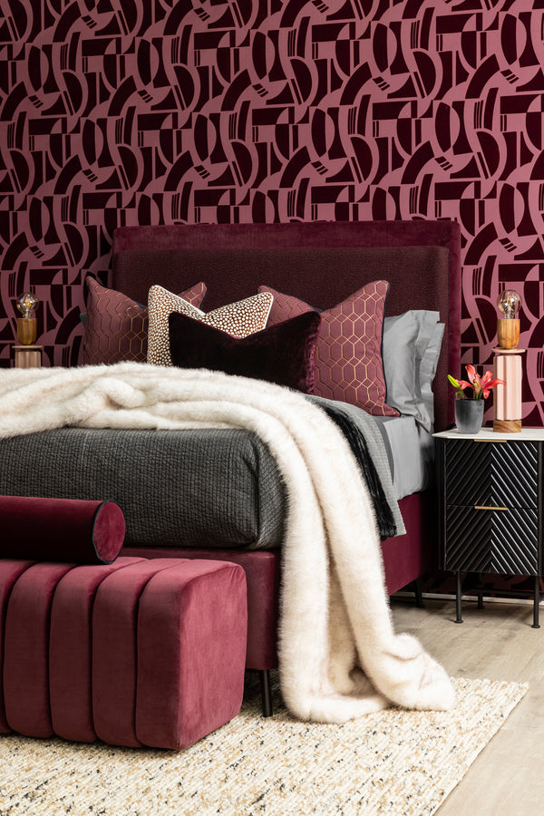 Burgundy bedroom with textured wallpaper by Giava Intteriors in South Africa