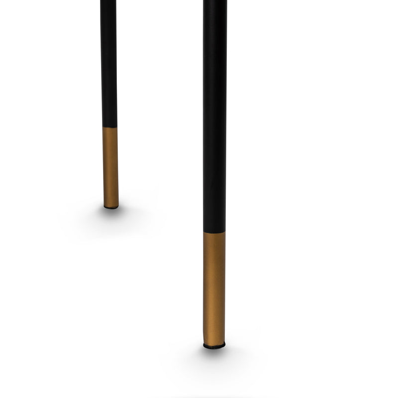 Metal leg detail on the double-back leather and fabric combo dining chair by Giava Interiors, South Africa