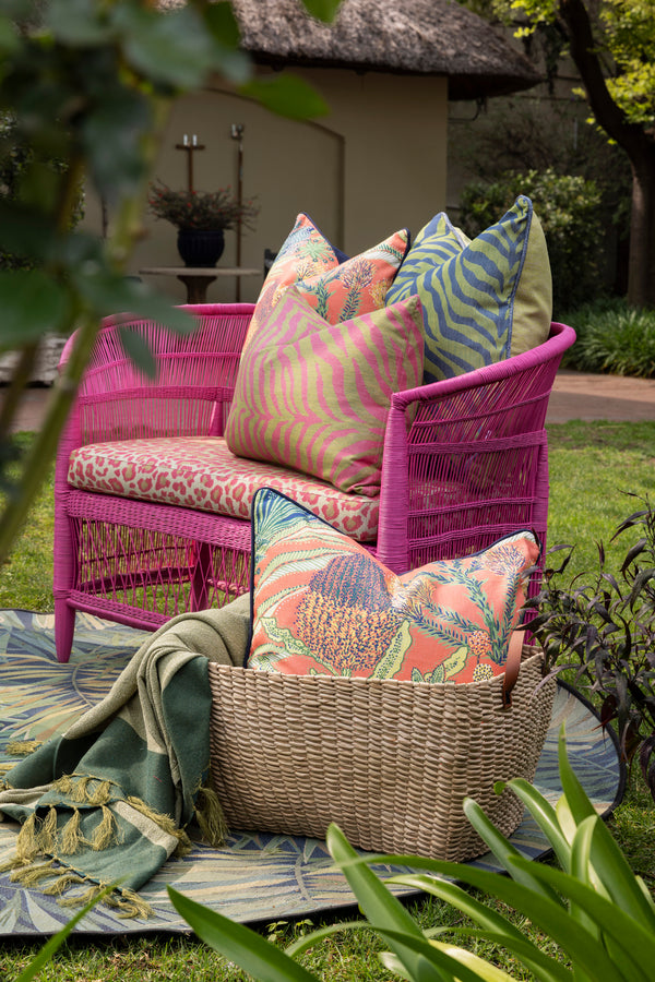 Colourful scatter cushions styled outdoors by Giava Interiors in South Africa