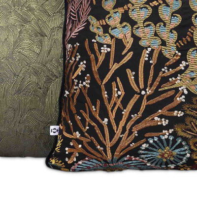 Moana Set by Giava Interiors – decorative scatter cushions with burnt orange boucle, embroidered botanical patterns, and green textured fabrics arranged in a stylish layered display.