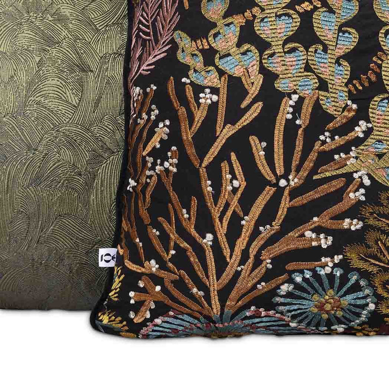 Moana Set by Giava Interiors – decorative scatter cushions with burnt orange boucle, embroidered botanical patterns, and green textured fabrics arranged in a stylish layered display.