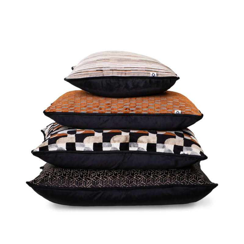 Mobel Scatter Cushion Set showcasing a stack of stylish textured cushions in various patterns and colors.